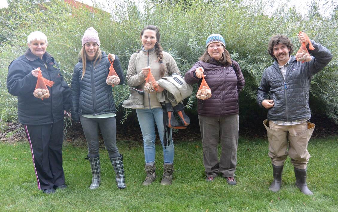 Photo of workshop participants holding their rock packs